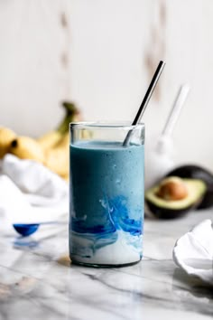 blue smoothie in a glass with coconut cream swirl and straw with banana and avocado in background Coconut Cloud Smoothie, Smoothie Inspiration, Cloud Smoothie, Smoothie With Coconut, Coconut Cloud, Blue Smoothie, Banana Drinks, Coconut Drinks, Drink Recipes Nonalcoholic