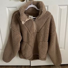 Half Zip Pull Over. Never Worn, No Stains Or Rips. Oversized And Super Soft. Cozy Brown Top For Cold Weather, Brown Fleece Sweater For Fall, Cozy Brown Fleece Sweater, Cozy Beige Tops For Cold Weather, Cozy Brown Sweatshirt For Fall, Cozy Beige Sweatshirt For Fall, Cream Fleece Sweater For Fall, Beige Fleece Tops For Fall, Cozy Beige Fleece Sweatshirt