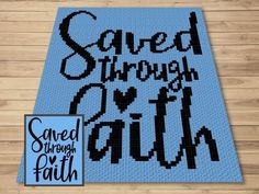 a cross stitch rug with the words saved through faith on it and an image of a cat