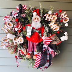 a christmas wreath with santa clause on it and holiday decorations around the wreath that says hope