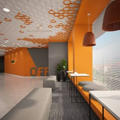 an office lobby with orange and gray walls, white tables and benches on the floor