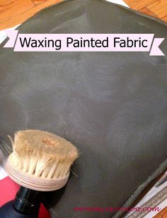 waxing painted fabric with a brush on top of it and the words waxing painted fabric