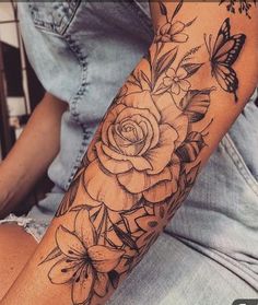 a woman's arm with flowers and butterflies tattooed on her left arm, next to the words new posts