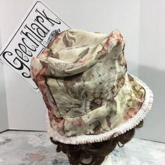 Beige Brimmed Top Hat For Spring, Floral Print Bucket Hat For Spring, Spring Floral Print Bucket Hat, Vintage Beige Brimmed Bucket Hat, Vintage Beige Wide Brim Bucket Hat, Vintage Beige Bucket Hat With Curved Brim, Vintage Beige Hat For Festival, Spring Floral Print Brimmed Hats, Spring Brimmed Hats With Floral Print