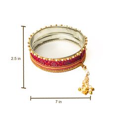 A specially curated Chalni for the auspicious celebration of Karwa Chauth.This Chalni is handmade with pure raw silk fabric and golden & pearl-colored beads that look stunning.Gift this Pooja Thali along with Chalni for your wife who would be keeping a fast for you on the festive occasion of Karwa Chauth!Let her know how much she means to you and the family.. Bollywood Style Festive Gift Sets, Festive Bollywood Gift Sets, Festival Gift Sets With Latkans, Festive Gift Sets With Latkans, Kundan Traditional Wear For Diwali Gift, Silk Thread Traditional Wear For Diwali Puja, Traditional Silk Thread Wear With Zari Work For Puja, Festive Sets With Latkans For Puja, Traditional Wear With Latkans As Gift