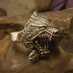 *  Amazing Details in this Wolf Ring, great texturing on the fur.*   Approx. 25mm x 40mm over 3/4 ounce of silver*  Hand made in our workshops in Devon*  .925 fully hall marked sterling silver ring*  Available in M - Z (use the drop down menu to order)*  Special Sizes are available on request Viking Style Silver Wolf Design Jewelry, Viking Style Silver Jewelry With Wolf Design, Collectible Viking Sterling Silver Jewelry, Medieval Silver Rings For Larp, Silver Wolf Design Symbolic Jewelry, Silver Symbolic Wolf Design Jewelry, Symbolic Silver Wolf Design Jewelry, Viking Odin, Tree Of Life Ring