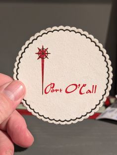 a person holding up a sticker with the word don't call on it