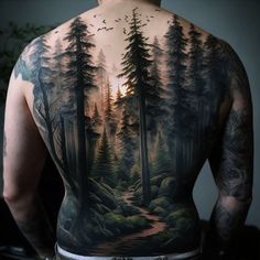 the back of a man's body with trees and birds painted on his back