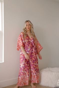 pink and purple boho paisley jumpsuit Bohemian V-neck Jumpsuits And Rompers For Brunch, Bohemian Printed V-neck Jumpsuits And Rompers, Long Sleeve Printed Jumpsuits And Rompers For Beach, Long Sleeve Printed Jumpsuits For Beach, Long Sleeve Printed Jumpsuits For The Beach, Chic Flowy Jumpsuits And Rompers With Floral Print, Bohemian Printed Jumpsuits And Rompers With V-neck, Chic Flowy Floral Jumpsuits And Rompers, Bohemian V-neck Printed Jumpsuits And Rompers