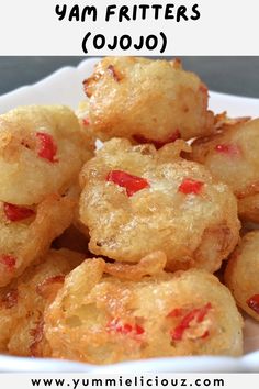 some fried food in a white bowl with the words yam fritters cojo