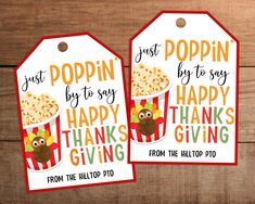 two tags with popcorn on them that say, just poppin by to say happy thanksgiving giving