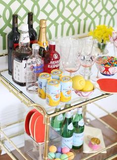 a bar cart filled with drinks and condiments