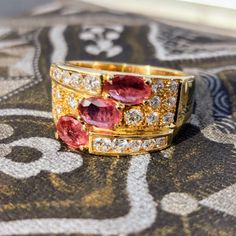 Ring Size: US 7 1/2 EU 56 Gold 19k Weight:  10.0 grams Diamonds 0.80 ct. Clarity: Si Color: G Natural Ruby 1.50 ct  Condition: Excellent Introducing the Ruby and Diamond 19k Gold Unisex Statement Ring, a captivating masterpiece of fine jewelry that exudes timeless elegance and individuality. Crafted with the utmost precision and attention to detail, this exceptional ring seamlessly combines the rich allure of rubies and the dazzling brilliance of diamonds with the lustrous beauty of 19-karat gol Luxury Yellow Gold Gia-certified Sapphire Ring, Luxury Gia Certified Yellow Gold Sapphire Ring, Luxury Emerald Cut Rings Of Aaa Quality, Fine Jewelry Gold Ruby Ring Gia Certified, Luxury Emerald Cut Rings With Aaa Quality, Luxury Emerald Cut Aaa Quality Rings, Fine Jewelry Yellow Gold Rings, Aaa Quality Fine Jewelry Yellow Gold Rings, Elegant Gia Certified Gold Ruby Ring