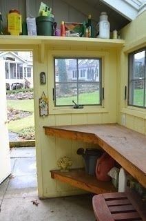 the inside of a small kitchen with lots of counter space and shelves on the wall