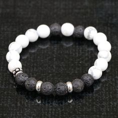 "Materials: Stones (Howlite & Lava) & White metal (rings) Size of beads: 8 mm each The number of beads: 12 (Howlite) & 8 (Lava) String: High quality stretchy Handmade in Nepal. Howlite is a stone of awareness. It will give you the gift of wisdom and enlightenment. It can help you connect to higher realms and remove the veils that are blocking the truths in your life. It also increases memory and desires to learn. Brings Patience. Calm. Positive & also Expands horizons and opens the mind to new knowledge. Besides that, it proves memory and facilitates learning. And, Fights overactive minds and insomnia. It is good for people who are angry and disappointed. Lava Stone is a grounding stone that strengthens one's connection to Mother Earth. It gives us strength and courage, allowing us stabili White Bracelet With Silver Beads, White Round Bracelets With Silver Beads, White Spiritual Bracelet With Silver Beads, White Spiritual Bracelets With Silver Beads, Spiritual White Bracelet With Silver Beads, Spiritual White Bracelets With Silver Beads, Adjustable White Bracelet With Polished Beads, Adjustable White Bracelets With Polished Beads, Howlite Bracelet