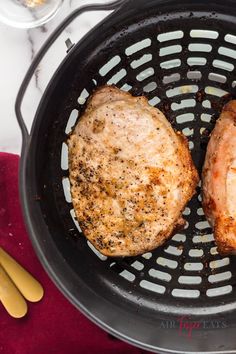 two hamburger patties in a frying pan next to bananas