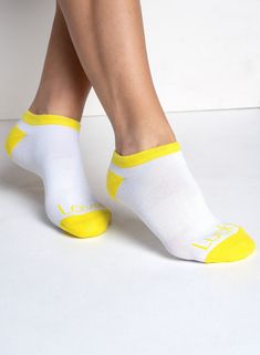 A classic look in classic colors. These high-performance ankle socks with retro pom poms bring some fun nostalgia to the court or course. Casual No-show Running Socks, Yellow Sporty Socks For Sports, Low Cut Socks, Tennis Shop, Dress Gift, Novelty Print, Long Sleeves Jacket, The Court, Ankle Socks