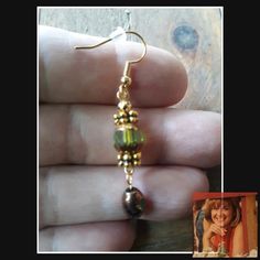 Gold color earrings with beautiful cathedral glass beads
#VictorianStyle #NatureLoverGift #GiftForHer #GiftForDaughter #CathedralGlass #BeadedDangles #GiftForFriend #GoldAndGreen #GiftForMom #GoldAndHoneyBrown Bronze Dangling Beads Earrings For Gift, Bronze Earrings With Dangling Beads For Gift, Elegant Copper Earrings With Dangling Beads, Elegant Brown Beaded Earrings With Gold Beads, Elegant Brown And Gold Beaded Earrings, Gold Czech Glass Beaded Earrings, Handmade Gold Beaded Earrings With Czech Glass, Green Gold Beaded Drop Earrings, Nickel-free Brown Beaded Earrings With Czech Glass