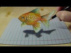 a drawing of a goldfish on a piece of paper with a pencil in it