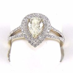 This Is A Fine Pear Cut Diamond Solitaire Ring W/Accents. It Is Made Of 100% Natural 14kt Yellow Gold And Is In Brand New Condition. It Has A Ctw Of 1.30ct And Weighs 3.3 Grams. The Fancy Diamonds Have A Clarity Of Si1 And Fancy Yellow And F Color. This Beautiful Custom Piece Has Excellent Pear Cut Diamond Stone In The Center Weighing .71ct And Brilliant Diamond Accents Along The Band Weighing .59ct. Samson Diamond Gia Certified White Diamond Ring In 14k Gold, Gold Pear-shaped Brilliant-cut Diamond Ring, Gold Diamond Ring With Brilliant Cut Pear Shape, Gold Pear-shaped Brilliant Cut Diamond Ring, Gold Pear-shaped Diamond Ring With Brilliant Cut, Yellow Gold Pear Diamond Ring For Anniversary, Pear-shaped Brilliant Cut Gold Diamond Ring, White Pear-shaped Diamond Ring With Diamond Cut, White Pear Shaped Diamond Ring With Diamond Cut