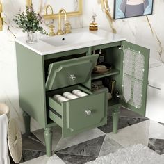 a bathroom with a sink and green cabinet