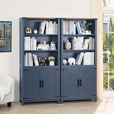 a blue bookcase with sliding doors in a living room