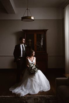 the bride and groom are posing for a photo