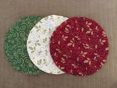 three round placemats sitting on top of each other