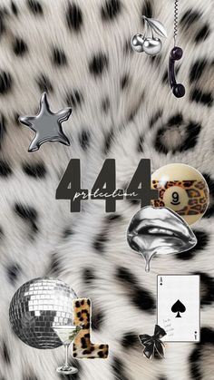 an animal print wallpaper with various objects on it's back side and the number four