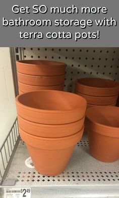 four clay pots sitting on top of a shelf in a store with the caption get so much more bathroom storage with terra cota pots