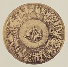 this is an image of a plate with people and animals on it in the center