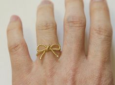 This stunning Twisted Rope bow knot ring is a perfect combination of elegance and charm. Handcrafted with care, this dainty bow tie ring features a delicate design in vermeil and sterling silver, adding a touch of sophistication to any outfit. Whether you're treating yourself or searching for a thoughtful friendship or birthday gift, this bow ring is sure to be a cherished addition to any jewelry collection. Celebrate special occasions with this timeless piece that symbolizes love and friendship Dainty Ribbon Jewelry For Gifts, Delicate Bow Jewelry As Gift, Delicate Bow Jewelry For Gifts, Delicate Butterfly Knot Jewelry As Gift, Delicate Bow Jewelry For Gift, Delicate Butterfly Knot Jewelry For Gifts, Gold Wedding Jewelry With Butterfly Knot Detail, Gold Dainty Bow Jewelry, Dainty Gold Jewelry With Bow Detail