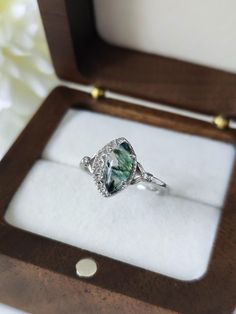 This ring is a special and unique piece of jewel for you your best friends and a perfect gift for all Bride lovers. It is made entirely of pure sterling silver 925. The rings comes with the shape of a white crescent moon holding a shiny and bright moss agate, a natural gemstone with inside filaments and patterns of green moss. Each moss agate will be different which makes this ring unique. Product details: Material: Sterling Silver 925 Color: Silver Ring Size: 5us, 6us, 7us, 8us, 9us, 10us, 11us Heirloom Crystal Ring As A Gift, Heirloom Crystal Ring As Gift, Heirloom Crystal Ring For Gift, Elegant Moonstone Ring Ideal For Gifting, Heirloom Crystal Ring With Accent Stones For Gift, Heirloom Crystal Ring With Accent Stones As Gift, Unique Rings With Halo Setting For Gift, Handmade Oval Moss Agate Ring, Unique Crystal Ring As A Gift