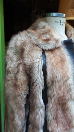 "THis is really great Furly True Vintage Coat!! LAmb very soft fur with mix leather skin in brown. CLosure working - free smoke - two pockets. Lining satin brown. In good condition (only very small part hair moved - attention pics). Measures: - Shoulder to shoulder: 18.9\" (48 cm) - Slevees: 22.83\" (58 cm) - Chest: 42.51\" (108 cm) - Hips: 44.09\" (112 dm) - Total Long: 37\"(94 cm) Thanks for stopping bY!!" Brown Sheepskin Coat With Faux Fur Trim, Brown Sheepskin Fur Coat With Faux Fur Trim, Mink Colored Leather Fur Coat With Faux Fur Lining, Mink Leather Fur Coat With Faux Fur Lining, Brown Faux Fur Coat With Feather Trim, Fluffy Brown Fur Coat For Winter, Fluffy Brown Fur Coat For Cold Weather, Brown Faux Fur Coat For Cold Weather, Vintage Lamb