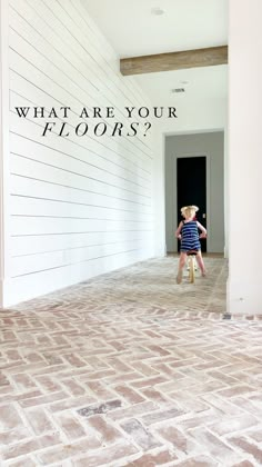 a little boy on a bike in front of a wall with the words what are your floors?