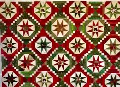 a red and green quilt with stars on it