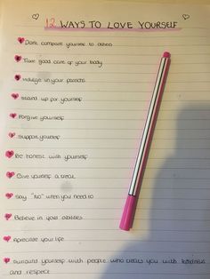 a pink pen sitting on top of a notepad next to a handwritten poem