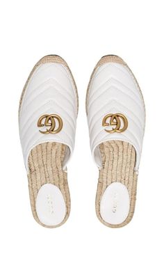 Gucci's Pilar espadrille slippers are crafted from matelassé chevron leather. Set on a classic woven sole for a laid-back edge, brushed gold-tone Double G hardware delivers a recognisable vacation-ready finish.Smooth leatherQuilted Contrasting logoGolden finishesContrast stitchingComposition: Leather 100%, metal 100%Lining Composition: Straw 100%Sole Composition: Rubber 100%Made in Italy Gucci Espadrilles, Open Toed Heels, Buy Gucci, Gold Ounce, Leather Espadrilles, Gucci Shoes, Heel Sandals, Smooth Leather, Mule