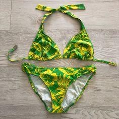 New Ralph Lauren Green/Yellow Tropical Print Swimsuit 2 Piece Bikini Set. Size Medium. Bright Green Color With Yellow Hawaii Tropical Flowers. Ralph Lauren Iconic High-End Bathing Suit. Top: Halter V-Neck Triangle Bikini Top. Adjustable Straps. Ties-Up On Neck. No Underwire. Bottom: Solid Bikini Bottoms With Full Coverage In The Back. Fully Lined. Hawaiian Floral Print Design. Stretchable. Super Soft & Comfortable. Style: R-42897u0 74% Nylon & 26% Spandex. Lining 100% Nylon. Hand Wash. New Without Tags In Excellent Condition. From A Clean, Smoke, Free, And Pet Free Home. Tropical Bathing Suits, Swimsuit 2 Piece, Bright Green Color, Hawaiian Floral Print, Hawaii Tropical, Tropical Bikinis, Tankini Swimsuit Top, Floral Print Design, Floral Swimsuit