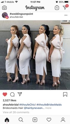 four women in white dresses standing next to each other