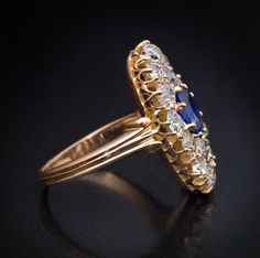 Circa 1890 The 14K yellow gold ring is centered with a 0.89 ct blue sapphire (likely of Ceylon origin). The center stone is surrounded by chunky old mine cut diamonds (G-H-I color, VS-SI clarity). Estimated total diamond weight is 1.60 ct. The sapphire and diamond cluster measures 20 x 11 mm (13/16 x 7/16 in.) Ring size 6 (16 mm) sizable Jewelry Girl, Old Mine Cut Diamond, 18k Gold Ring, Put A Ring On It, Elegant Ring, Diamond Cluster Ring, Yellow Gold Ring, Dream Jewelry, Diamond Cluster