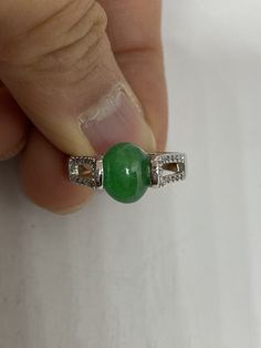 Vintage Lucky Green Nephrite Jade ring Fun jade is color enhanced Large green nephrite jade Ornate German Silver Vintage ring, does not tarnish, NOT sterling Size 7, 8 or 8.5 All rings are shipped free in the US in a nice gift box. Check out our over a THOUSAND great reviews Engraving is $4 per letter and is not always perfect depending on the piece. It can take a few days if the jeweler is busy. This is payable to Paypal Judithsltd@gmail.com Green Cabochon Round Stone Rings, Green Jade Round Stone Jewelry, Green Jade Jewelry With Round Stone, Green Crystal Gemstone Ring, Green Gemstone Crystal Ring, Jade Gemstone Ring With Round Stone, Jade Rings Oval Cabochon For Anniversary, Jade Gemstone Rings For Healing, Green Oval Cabochon Ring With Center Stone