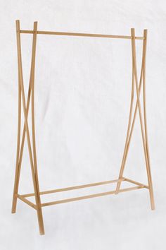 a wooden clothes rack with two hanging bars