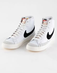 NIKE Blazer Mid '77 Womens Shoes - WHT/BLK | Tillys Nike Blazer Mid 77 Woman, Retro Nike High-top Sneakers With Gum Sole, Nike Retro High-top Sneakers, Nike Retro Lace-up Skate Shoes, Retro Nike Skate Shoes With Rubber Waffle Outsoles, Retro Nike Lace-up Skate Shoes, Retro Nike High-top Sneakers With Round Toe, Retro Spring Skate Shoes With Gum Sole, Retro Skate Shoes With Laces