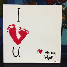 i love you hand and foot print on white paper with red ink in the shape of a heart