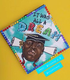 a close up of a graduation cap on top of a yellow surface with the words pima's all in it