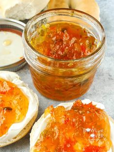 there are some breads with sauce on them next to the other food in bowls