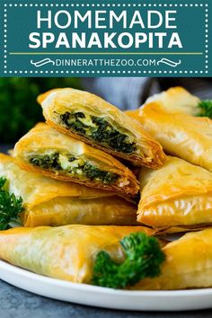 some food is on a plate with broccoli and cheese in the middle that says homemade spanakopita