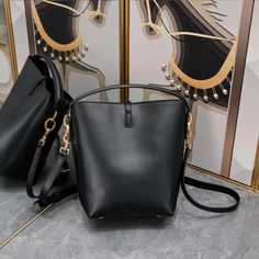 Designer Calfskin Bucket Bag: Genuine Leather, Crossbody Style with Large Capacity Leather Bucket Satchel For On-the-go, Luxury Large Capacity Bucket Bag For On-the-go, Luxury Bucket-shape Shoulder Bag For On-the-go, Luxury Bucket Shoulder Bag For Travel, Luxury Bucket Shape Shoulder Bag For Travel, Luxury Bucket Box Bag For Everyday Use, Luxury Black Bucket Box Bag, Luxury Bucket-shape Box Bag For Everyday Use, On-the-go Large Capacity Double Handle Bucket Bag