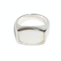 This is our 'Archie' ring from our flat top Thomas collection. With its flat, barrel face adorned with a high polished, 16x12mm white mother of pearl, the 'Archie' ring combines practicality and edge. This unisex signet ring is a go-to piece with endless wearability. White mother of pearl has a tremendous ability to calm and lessen the fears of those who wear it, it is especially helpful for anyone whose life is intense and stressful. White Mother of Pearl No two stones are alike Available in St Modern Silver Enamel Ring For Formal Occasions, Classic White Oval Dome Ring, Luxury White Signet Ring With Polished Finish, White Polished Signet Ring For Formal Occasions, Minimalist White Gold Moonstone Ring With Polished Finish, Minimalist White Rings With Polished Finish, Formal White Signet Ring With Polished Finish, White Enamel Ring With Polished Finish For Anniversary, Modern Pearl Open Ring With Polished Finish